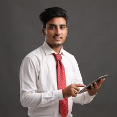 young-indian-businessman-employee-using-smartphone_438239-311